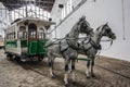 Rare green and white tram with horses. horsecar with two horses in a harness