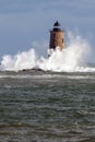 Rare High Tide Causes Giant Waves to Break Around Stone Lighthouse