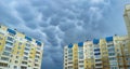 Rare and menacing mammatus clouds loom over residential high-rise buildings Royalty Free Stock Photo