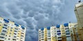 Rare and menacing mammatus clouds loom over residential high-rise buildings Royalty Free Stock Photo