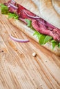 Rare roast beef on a crusty baguette Royalty Free Stock Photo