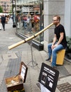 Man plays the Didgeridoo on the streets of Nuremburg Germany Royalty Free Stock Photo