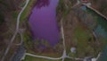 Rare thing natural spectacle Gipsbruchweiher pond in Allgau glows purple in Fussen, Bavaria, Germany. Lake from gypsum