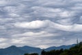 Rare, unusual Asperitas cloud, Italy. Lungiana area.