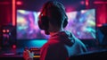 Rare view of pro gamer in headphones live streaming while playing online computer game, neon lights, esports concept