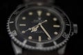 Rare vintage Rolex submariner diver`s wristwatch on black background