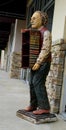 rare vintage statue bust of the famous scientist Albert Einstein holding a stack of books, full body standing. Fiberglass resin