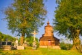 Crucifix in the front of the Wooden church of Saint Michael the Archangel in Prikra during summer sunset Royalty Free Stock Photo