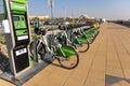 Careem eco-friendly green bike rentals in a row at Marjan Island for exercise and fun Royalty Free Stock Photo