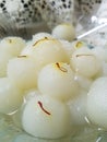 Rasagolla, a Bengali delicacy- served with saffron strands