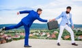 Rascal racketeer extortionist cheating handover. Men suits handover briefcase. Business deal landscape background Royalty Free Stock Photo