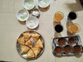 Rasgulla, samosa, colddrink with  sweet chutney for evening refreshments. Royalty Free Stock Photo