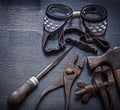 Rasp pliers clamp hammer goggles Royalty Free Stock Photo