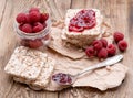 Raspberries berries, raspberries jam,bread on wooden table. Breakfast healthy eating Royalty Free Stock Photo