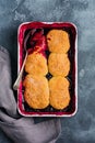 Raspberries and black currants cobbler with raspberry ice cream in baking dish. Homemade fruit pie pastries. Gray vintage backgrou Royalty Free Stock Photo