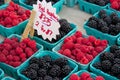 Raspberries and blackberries for sale at farmers' market Royalty Free Stock Photo