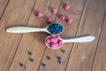 Raspberries and blueberries in spoons on wooden Royalty Free Stock Photo