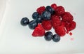 Raspberries and blueberries.White background