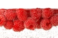 Raspberries in carbonated water isolated on white Royalty Free Stock Photo