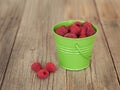 Raspberries in a green bowl