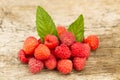 Raspberries with mint leaves closeup on wooden background, top view Royalty Free Stock Photo