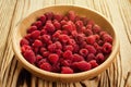 raspberries in a plate,in wooden bowl,basket/bush branch/growing raspberries,raspberries background closeup photo,high resolution Royalty Free Stock Photo