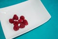 Raspberries.Turquoise background.Copy space Royalty Free Stock Photo