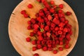 Raspberries on a wooden plate. On a black background close-up. wooden tray. view from above. place for writing. Fresh raspberries Royalty Free Stock Photo