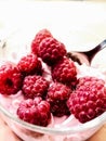 Raspberries in yogurt, dessert. Natural yogurt with fresh raspberries. raspberries in whipped cream