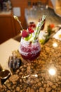 Raspberry alcohol cocktail on the bar. red cocktail garnished with raspberries on bar background Royalty Free Stock Photo