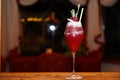 Raspberry alcohol cocktail on the bar. red cocktail garnished with raspberries on Christmas background Royalty Free Stock Photo