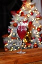 Raspberry alcohol cocktail on the bar. red cocktail garnished with raspberries on Christmas background Royalty Free Stock Photo