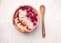 Raspberry banana smoothie bowl topped with raspberries, banana, coconut and goji berries Royalty Free Stock Photo