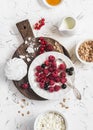 Raspberry, black currant, cheese, cream, granola, honey, meringue - tasty breakfast or snack. Royalty Free Stock Photo