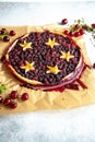 Berry pie with dough stars on a baking paper