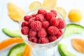 Raspberry bowl on wood