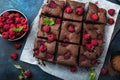 Raspberry brownies on blue background Royalty Free Stock Photo