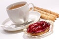 Raspberry cake with a cup of tea and biscuits Royalty Free Stock Photo