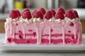Raspberry cake slice on white plate in soft natural light. Neural network AI generated Royalty Free Stock Photo