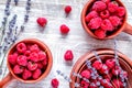 Raspberry composition with dry lavender rustic background top view