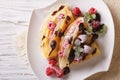 Raspberry crepes with chocolate and mint closeup. horizontal top