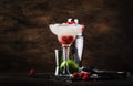 Raspberry daiquiri, alcoholic cocktail with white rum, lime juice, raspberries and crushed ice in tall glass, on wooden bar Royalty Free Stock Photo