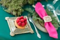 Raspberry dessert. table setting. Wedding decor in the magic forest for a loving couple. Pink and green colors. Royalty Free Stock Photo