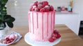 Raspberry drip cake kitchen counter background Royalty Free Stock Photo