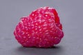 Raspberry drops on grey background Royalty Free Stock Photo