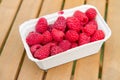 Raspberry fruits in a punnet Royalty Free Stock Photo