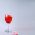 Raspberry fruity mix splash glass of wine red liquid fruit splashing berry drink on white background Royalty Free Stock Photo