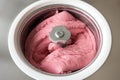 Raspberry Ice Cream Churning in Ice Cream Machine Royalty Free Stock Photo