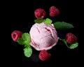 Raspberry ice cream with fresh berries and mint. Royalty Free Stock Photo