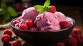 Appetizing pink ice cream with fresh raspberries and mint